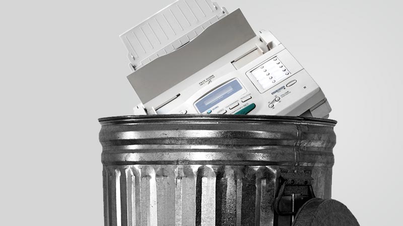 Fax machine in a trash bin