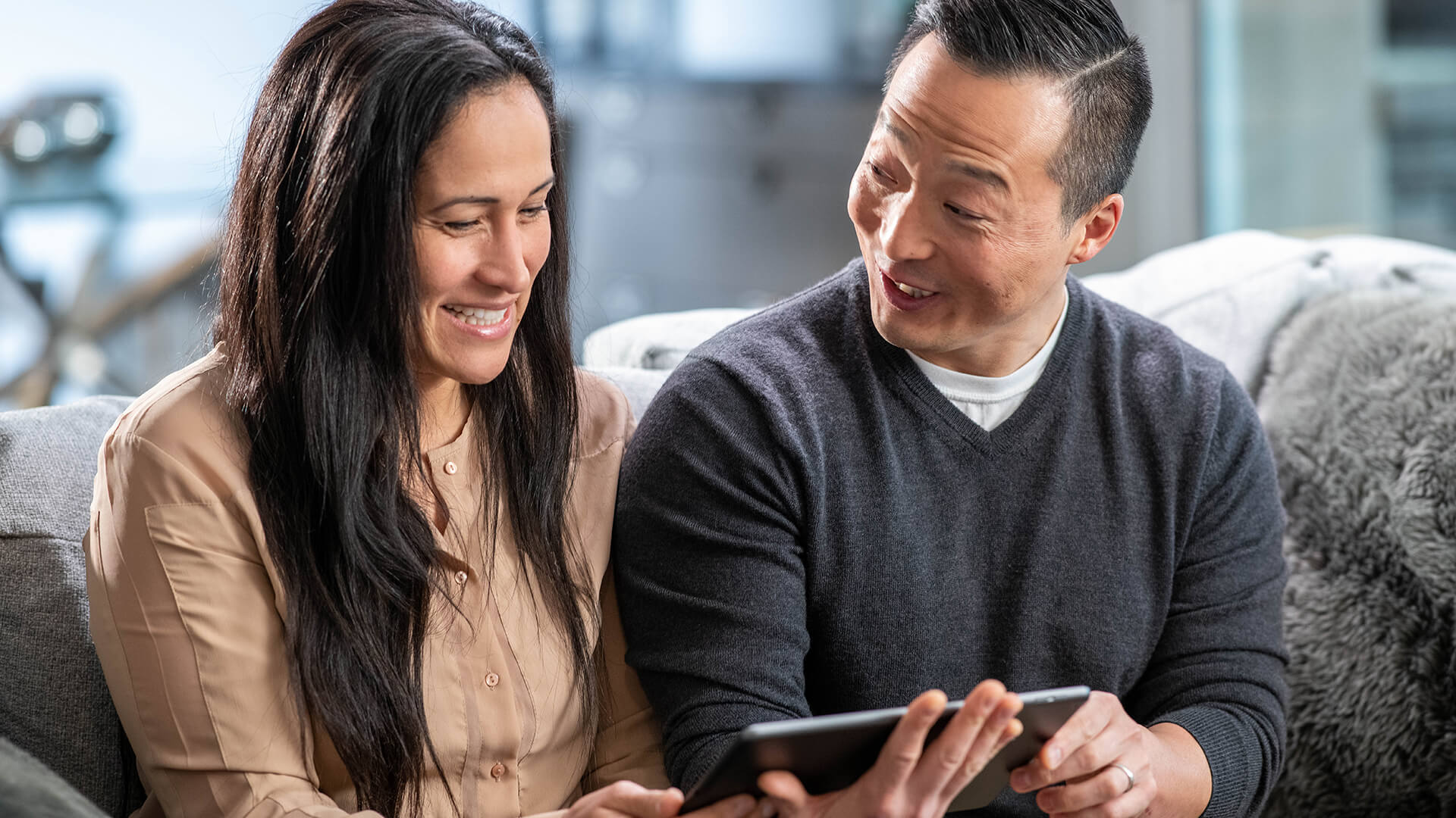 Couple enjoying iPad | AdvancedMD