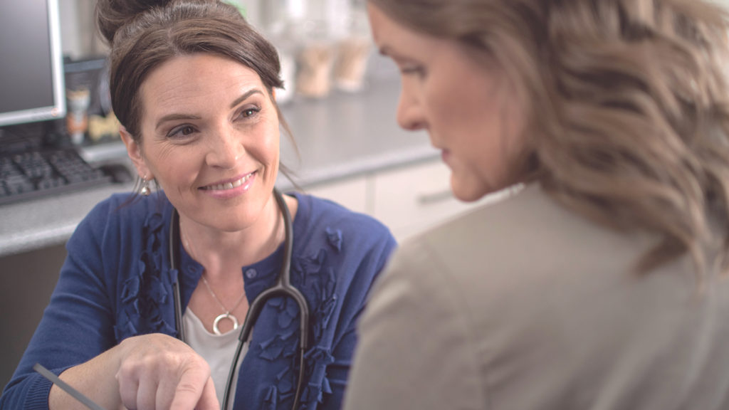 doc Smiling at Patient