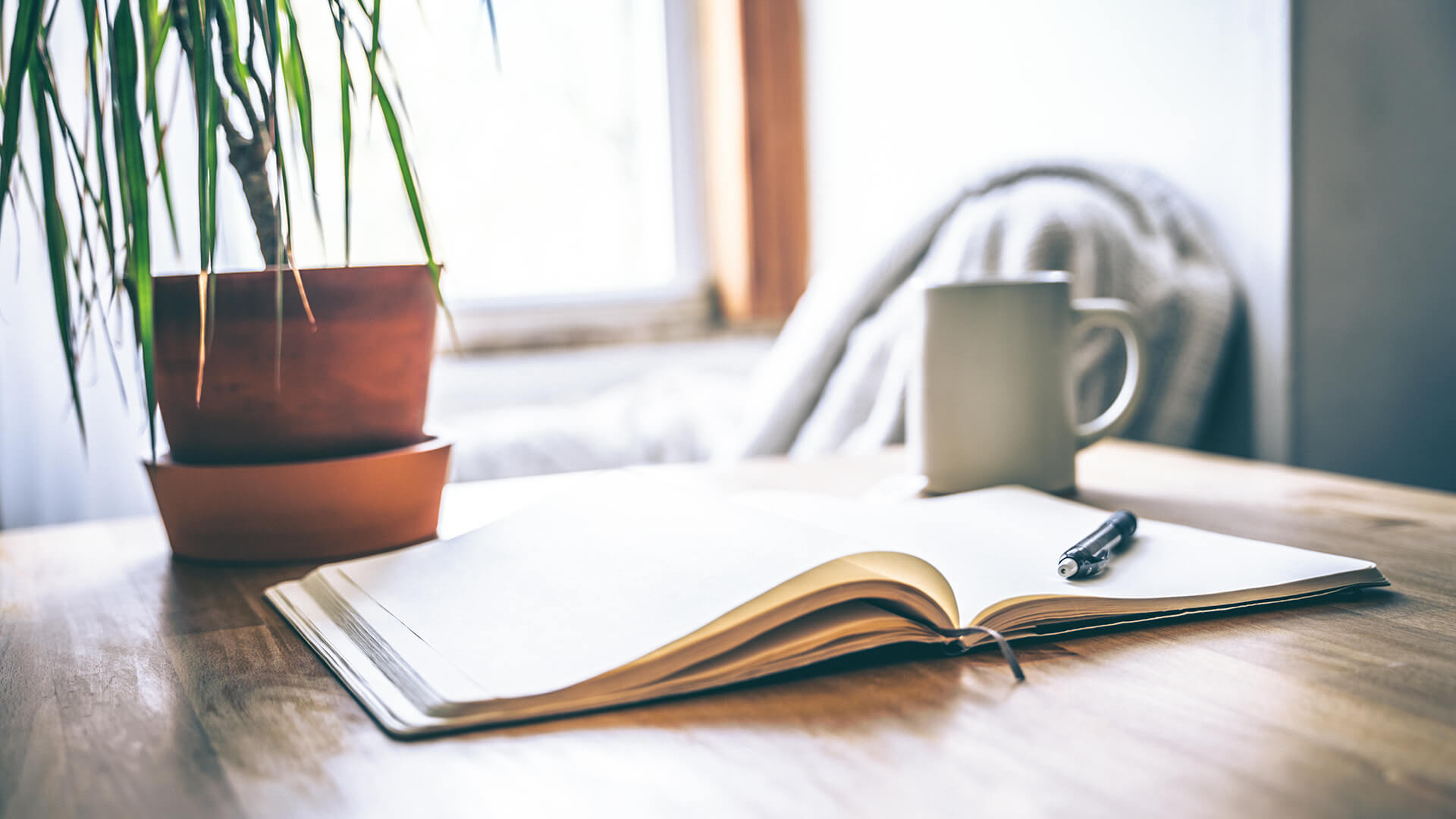 mug notebook pen desk