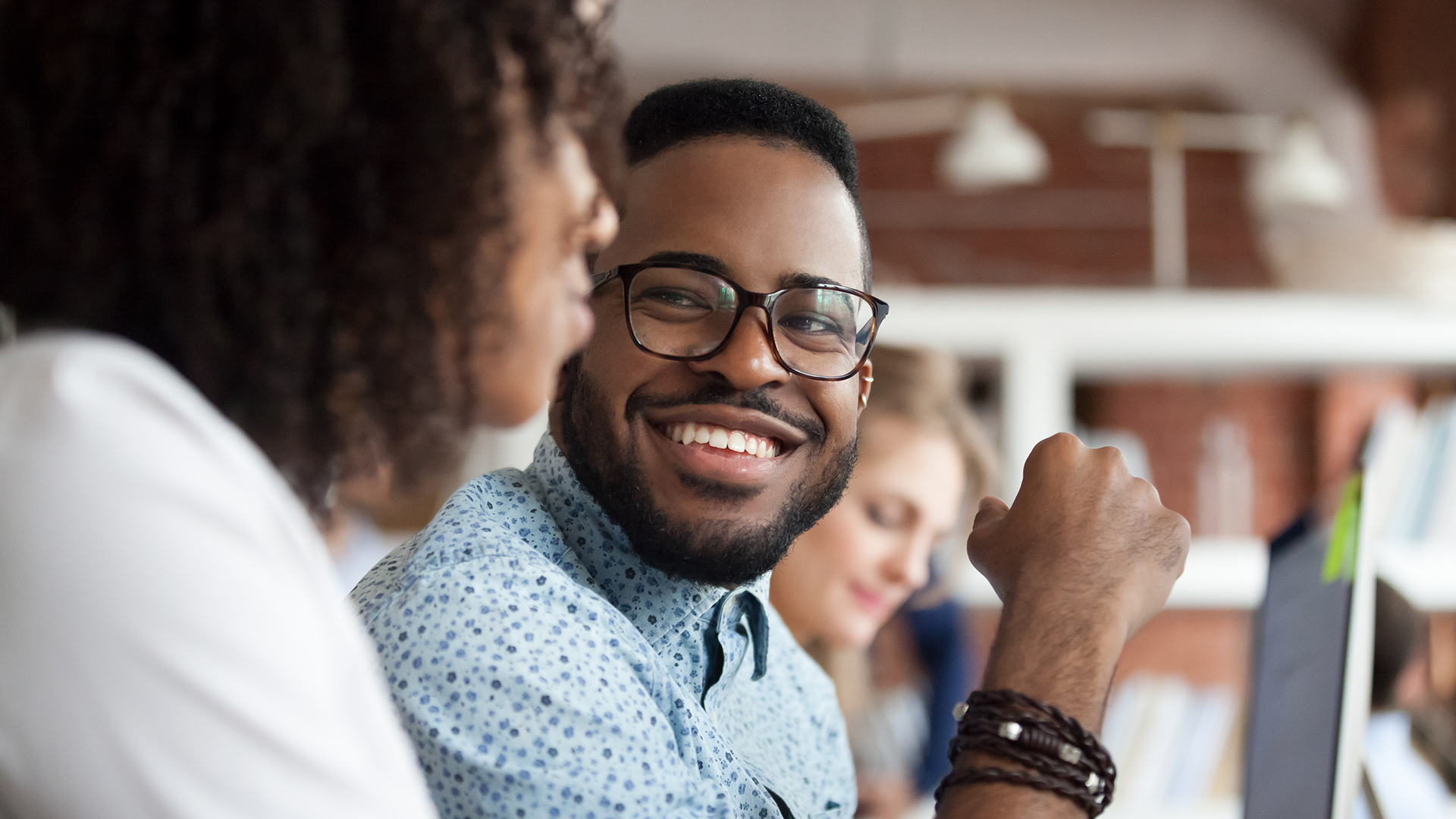 man wearing glasses smiling