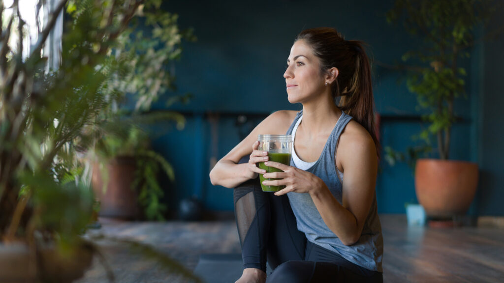 woman enjoying a detoxifying drink