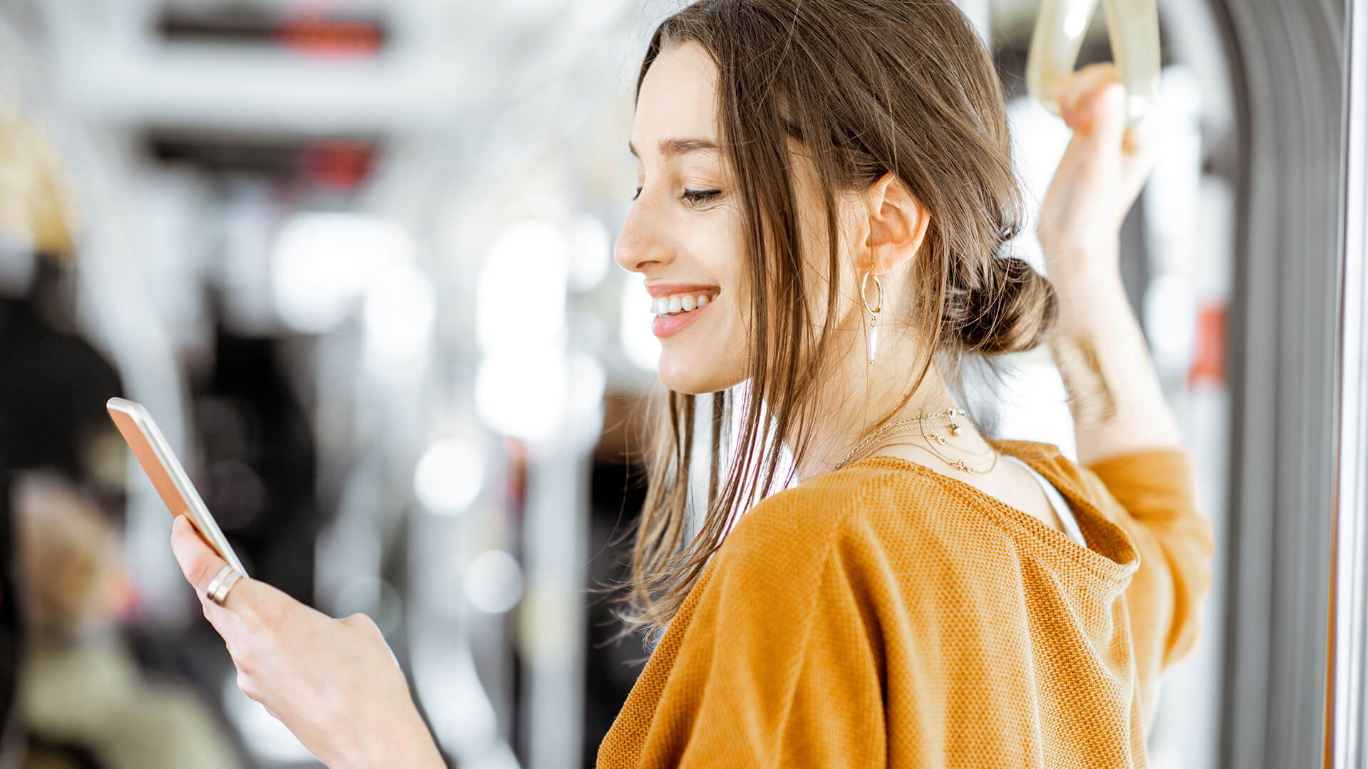 woman wearing yellow sweater on the train | Virtual Practice