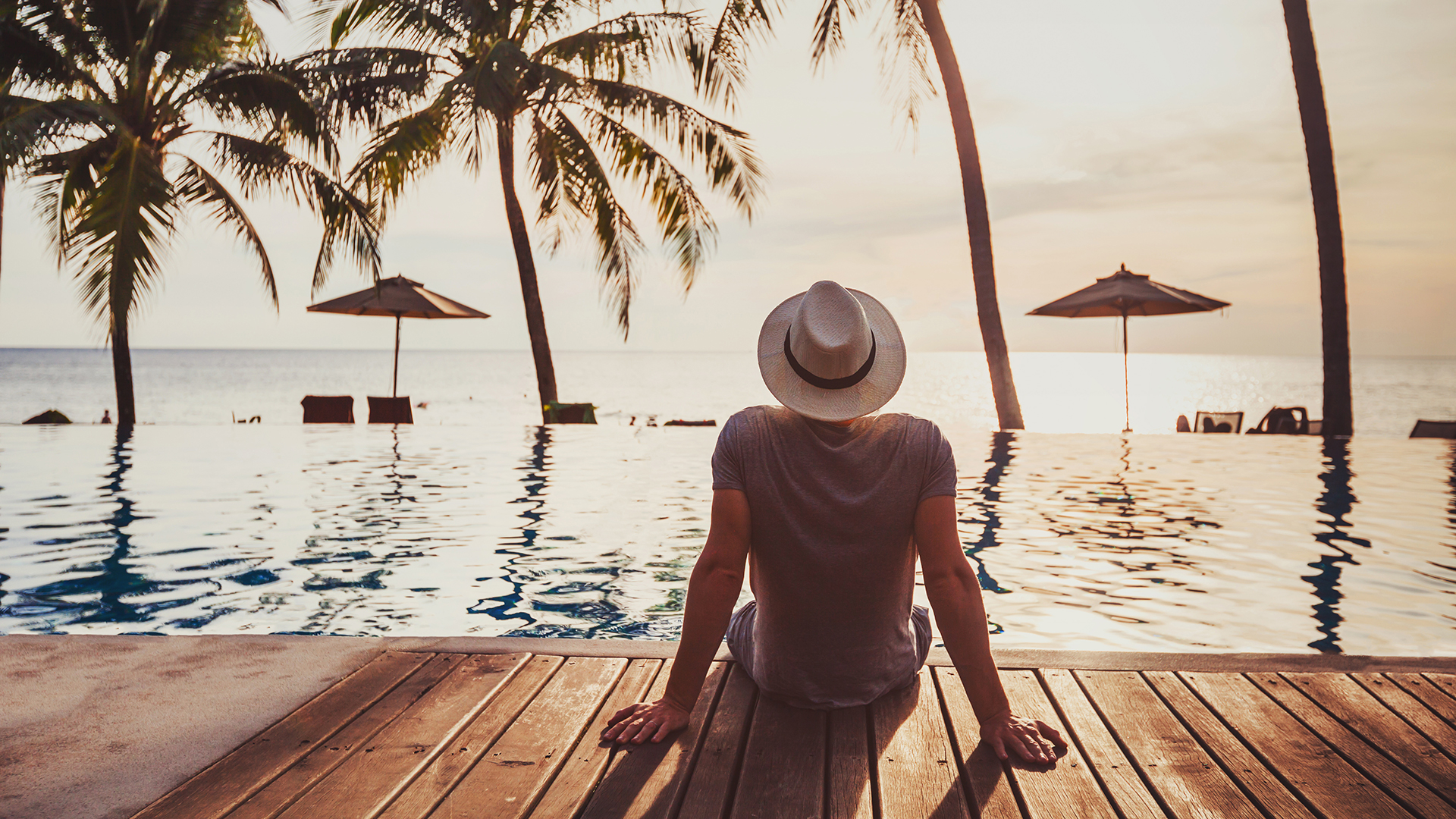 man in resort looking over the horizon