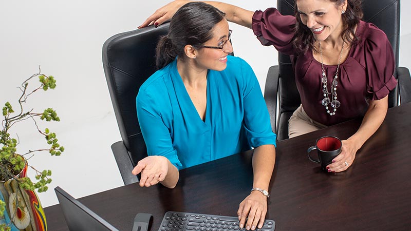 Two women talking in the office