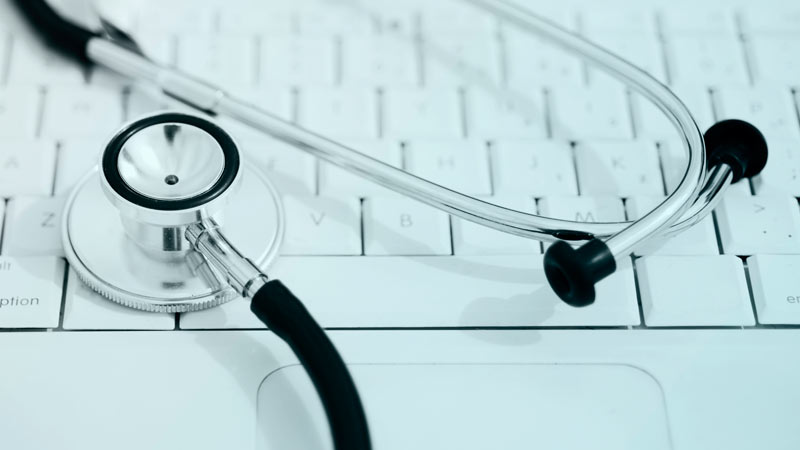 Stethoscope on laptop keyboard